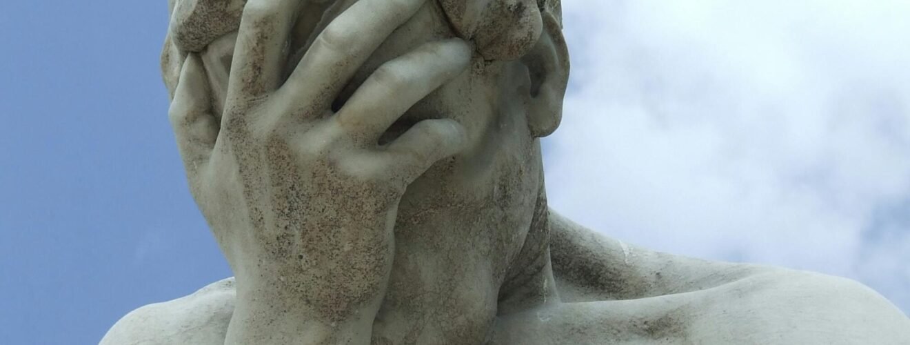 A dramatic close-up of a renowned statue in Paris expressing frustration.